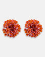 Pareja de pendientes de botón redondos en color naranja mandarina de la firma Dublos, mostrando su textura esférica y el brillo de sus cristales iridiscentes.