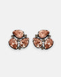 Pareja de pendientes de botón Bohemme con circonitas melocotón en talla pera sobre plata oxidada.