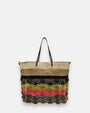 Maxi bolso tote hecho de saco reciclado con franjas de pompones en rosa, verde y negro.