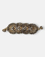Maxi pulsera ancha Tataborello extendida con eslabones radiales dorados, piedras de ágata gris y cierre magnético.