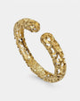 pulsera rígida Cosima de Maria e Luisa Jewels en plata 925 chapada en oro amarillo con calado rústico de abanicos.