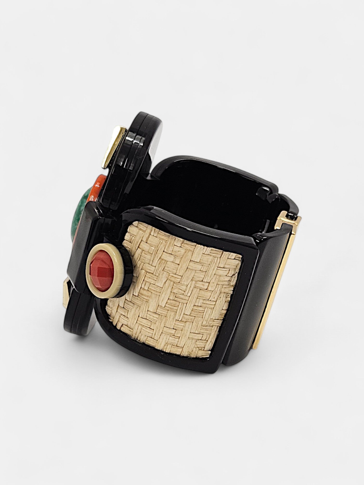 Brazalete Art Déco con piedras en verde esmeralda y rojo coral