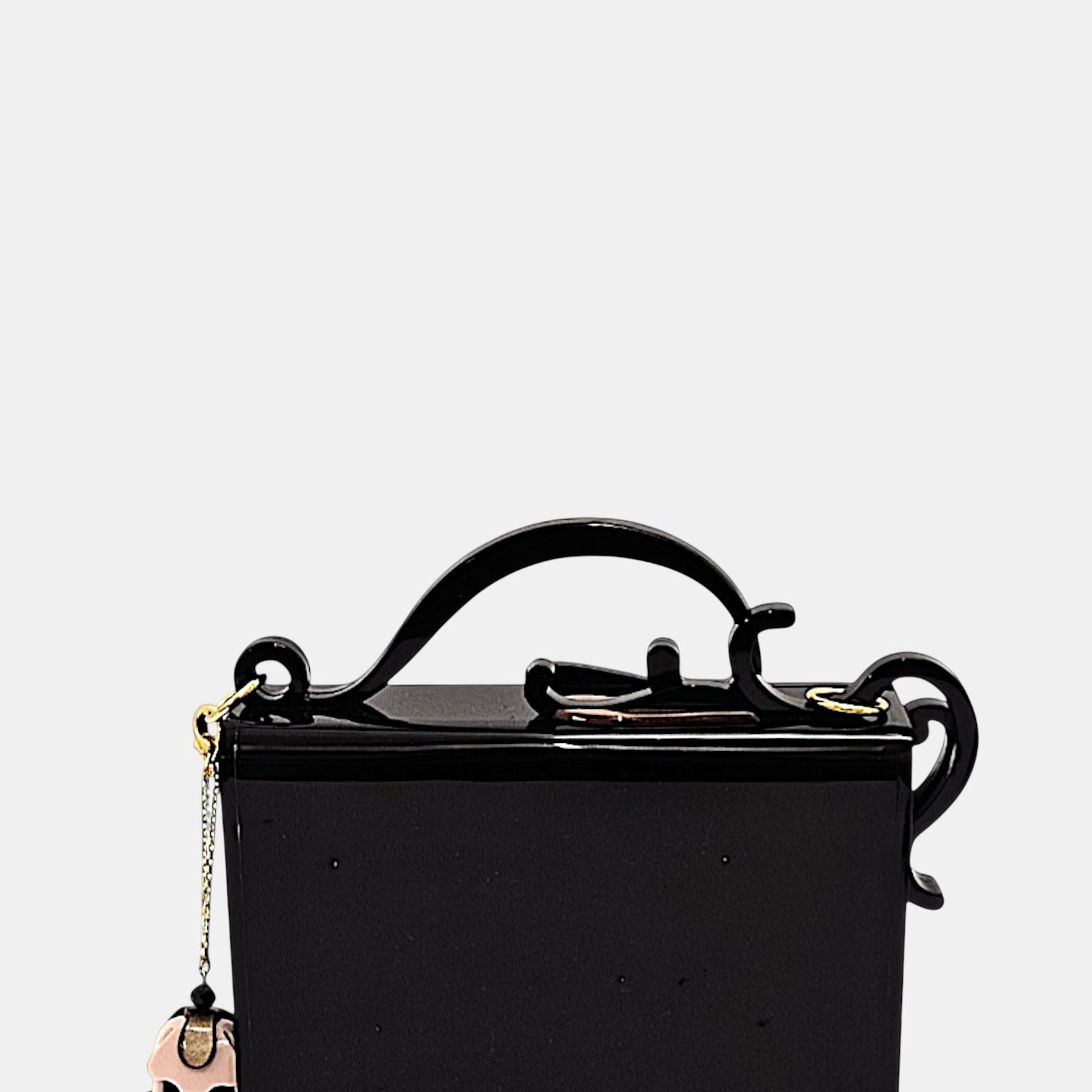 Bolso Gissa Bicalho de metacrilato negro con flores en relieve