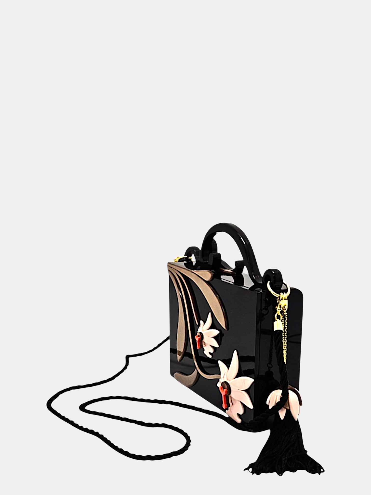 Bolso Gissa Bicalho de metacrilato negro con flores en relieve