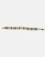 Pulsera fina Tataborello extendida con eslabones dorados en forma de gota y pequeños cristales ópalo.