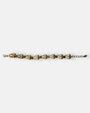 Pulsera fina Tataborello extendida con parejas de eslabones dorados en forma de gota y cristales topacio ahumado.