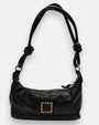 bolso Bianca de piel negra con asas tubulares anudadas y parche central de piel con tachuelas doradas.
