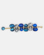 pulsera Galet Bleu de Dominique Denaive en resina artesanal con doble hilera de cuentas orgánicas en azul cobalto, turquesa y plata.
