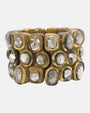 pulsera ancha Garance Argent de Dominique Denaive en resina dorada con tres hileras de cabujones en plata nacarada.