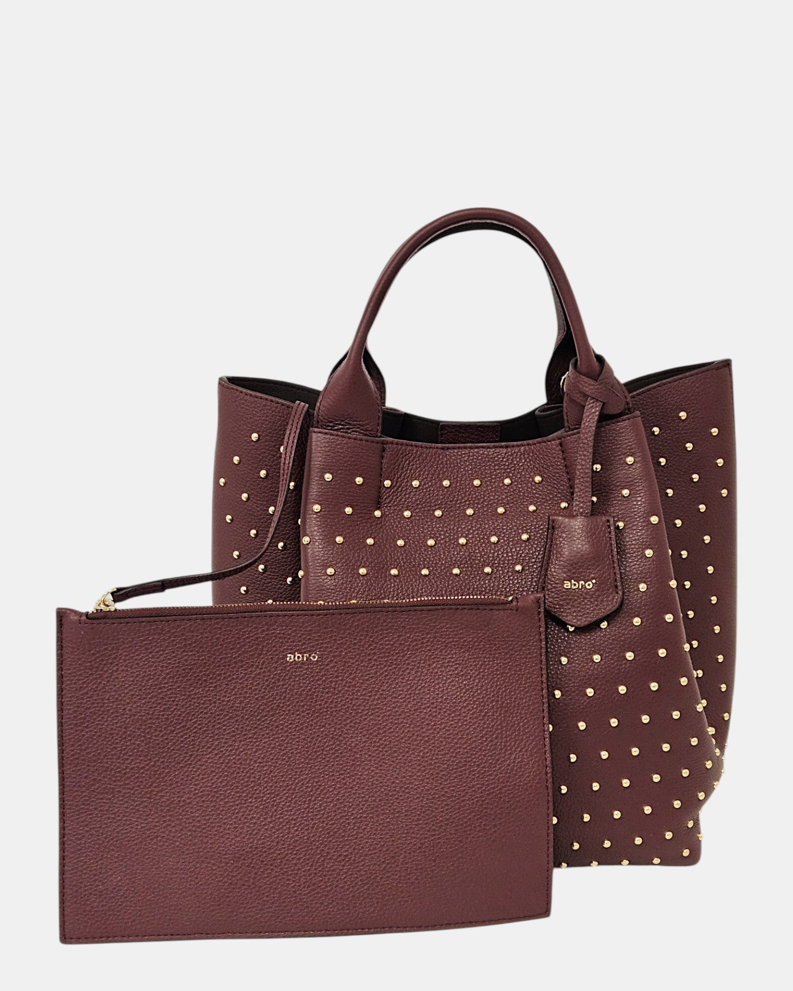 Bolso shopper burdeos con tachuelas doradas