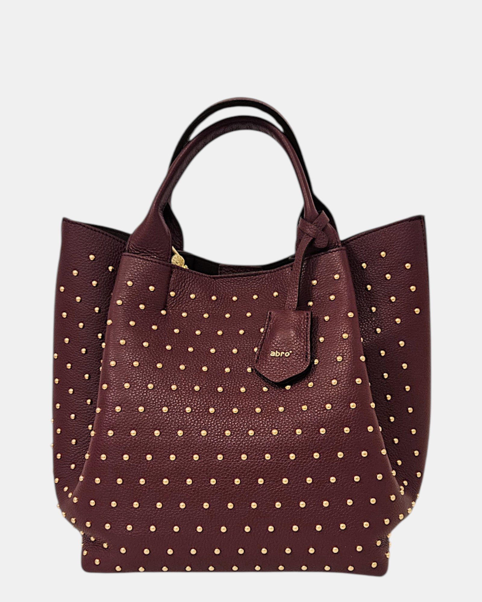 Bolso shopper burdeos con tachuelas doradas