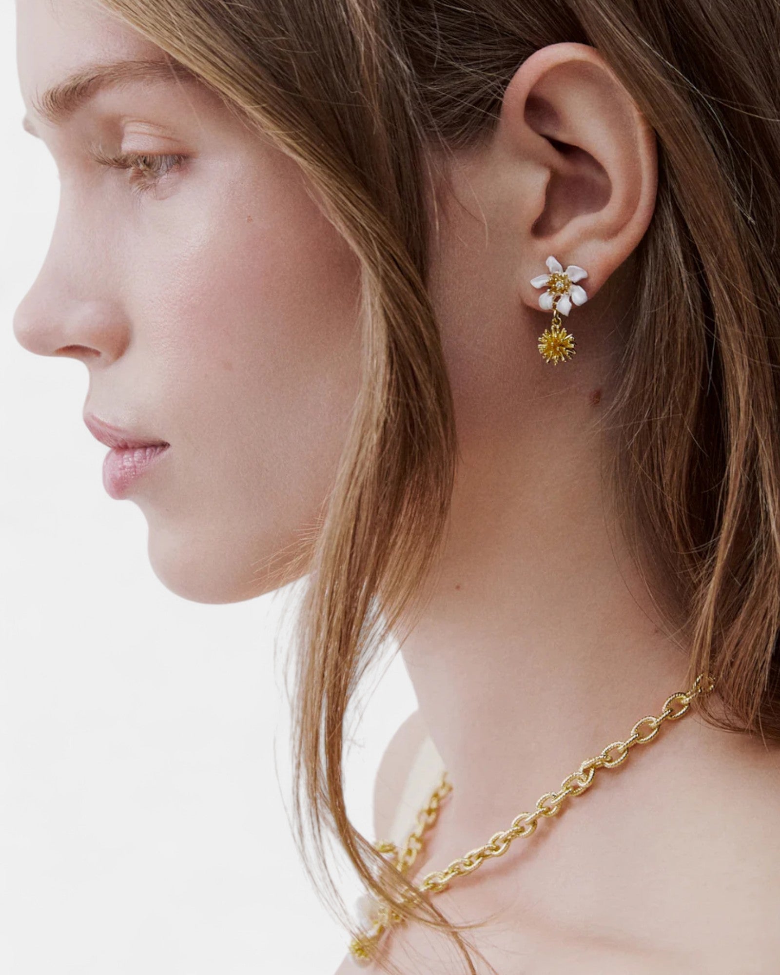 Earrings with small beads and a white clematis flower