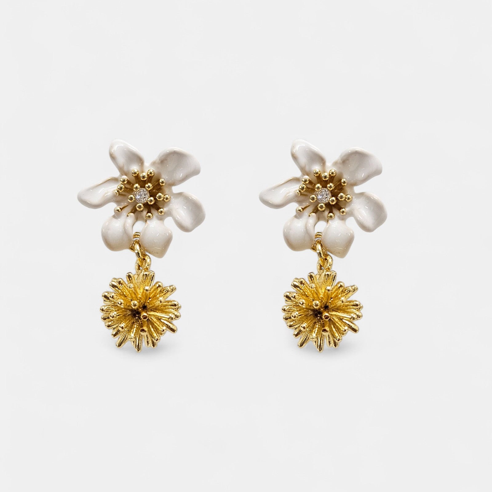 Earrings with small beads and a white clematis flower