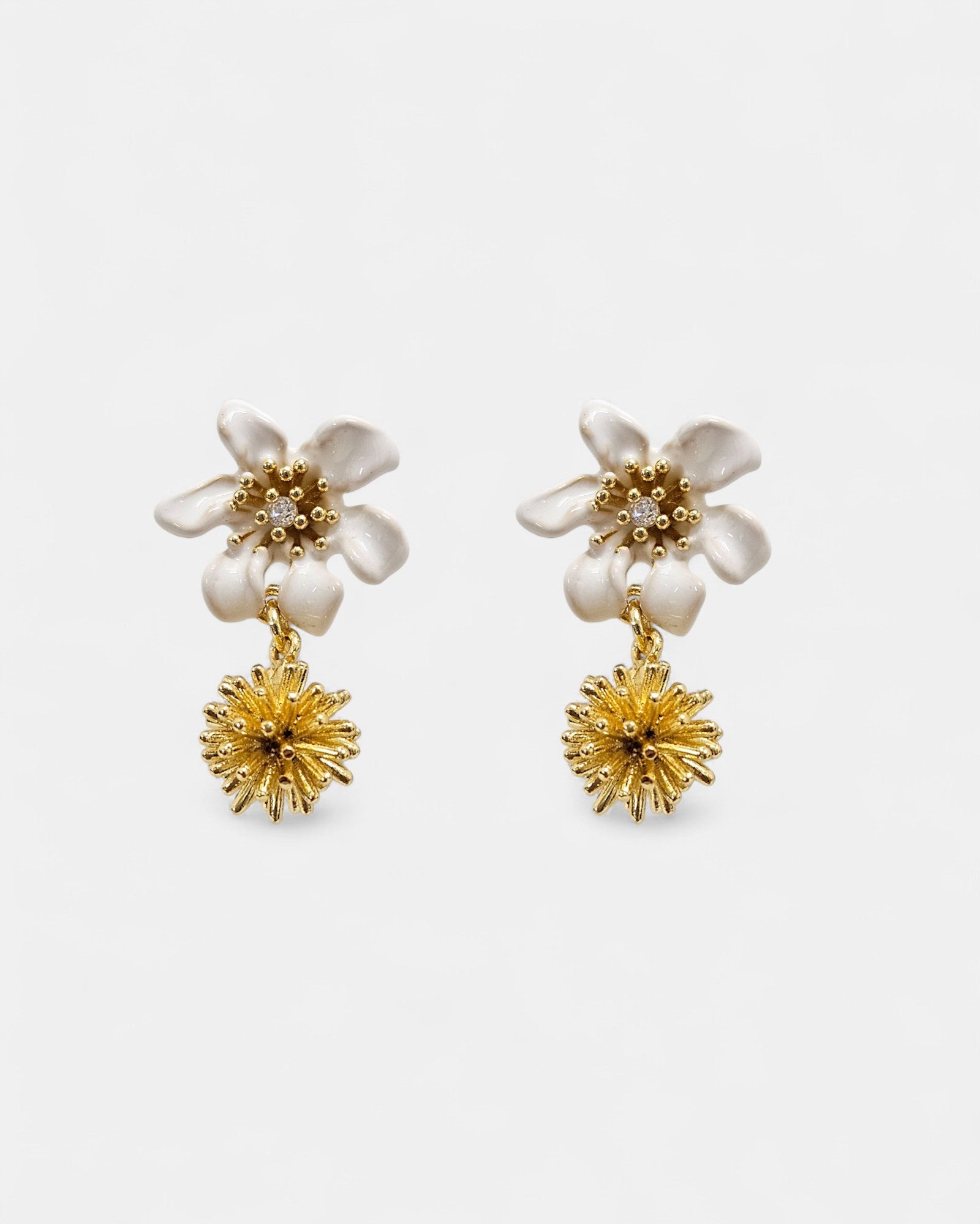 Earrings with small beads and a white clematis flower