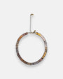 Gargantilla choker Tataborello extendida en círculo mostrando la hilera continua de cristales rectangulares y su cadena alargadora.