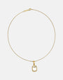 Collar Toscana de Maria e Luisa con su cadena fina dorada y colgante rectangular de cuarzo transparente.